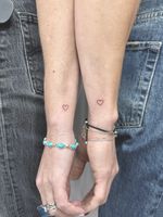 Matching Fine Line Heart Tattoos