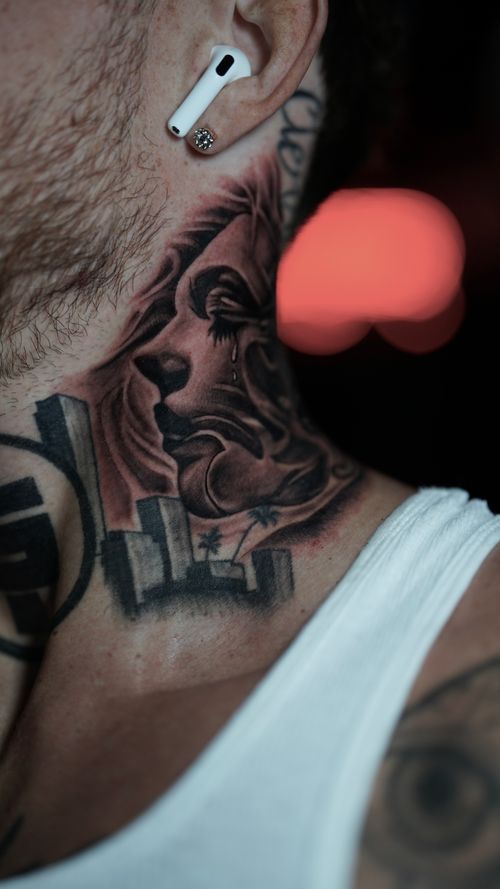 Crying Woman and Cityscape Neck Tattoo