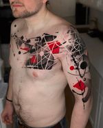 Abstract Chest and Arm Tattoo