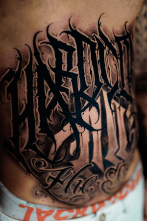 Bold lettering tattoo style