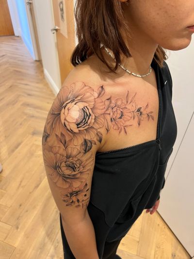 Beautiful and delicate peony flower tattoo by Ion Caraman, perfect for those who appreciate fine line floral designs.