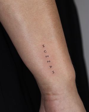 Small lettering tattoo style