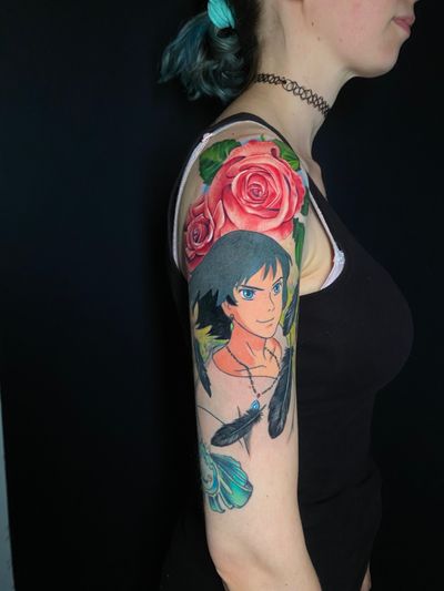 Vibrant tattoo featuring a rose and feather inspired by Howl's Moving Castle in anime realism style by Marie Terry.