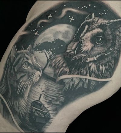 A serene scene featuring a moonlit lake with an owl, cat, and tree silhouetted against the night sky, with a boat gently sailing on the water. Realistic black and gray style by artist Cara Hayward.