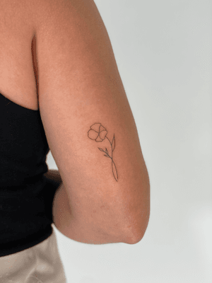 A delicate and dainty fine line tattoo by Chloe Hartland, featuring a minimal singleline outline motif.