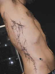 Thorny Web Rib Tattoo