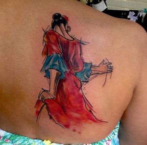Dive into the mystical world of gipsy culture with this beautiful watercolor tattoo on your upper back. Created by Sandro Secchin.