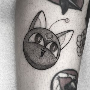 Capture the magic of Sailor Moon with this anime style tattoo featuring Luna the cat, by artist Barbara Nobody