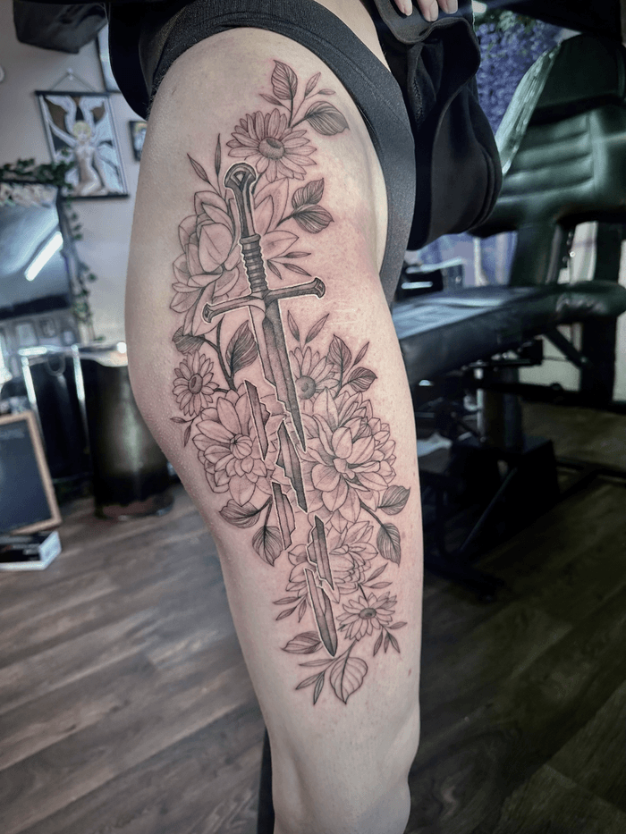 Sword and Floral Tattoo • Tattoodo