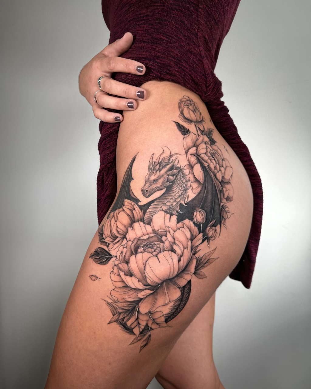 Dragon Thigh Tattoo with Floral Magic