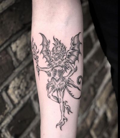 Get inked with a captivating devil demon tattoo by renowned artist Amandine Canata. Perfect for those who embrace their darker side.