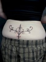 Ornamental Lower Back Tattoo