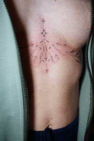 Chest Ornament Tattoo