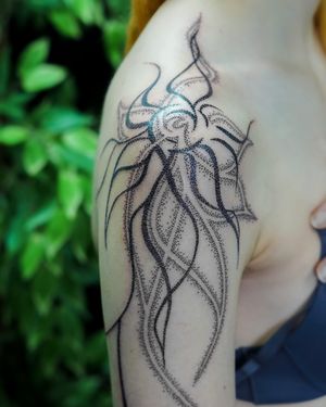 Experience the intricate beauty of ornamental dotwork by Mona Noir Tattoo, in a design that flows organically across your skin.