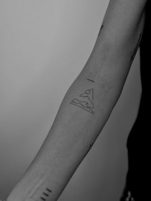 Fine line tattoo by Ruth Hall depicting a serene and abstract scenery in a minimalistic style.