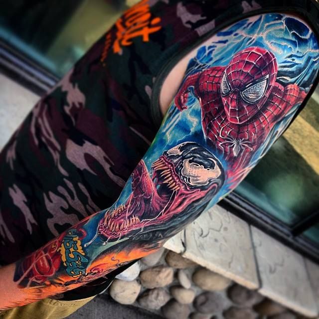 Spider-Man sticker tattoo on the thigh.