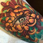Healed photo of a chrysanthemum and eyeball I tattooed at Grit N’ Glory. #chrysanthemum #eye #tattoo #meganmassacre #gritnglory