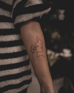 Woman's Profile with Floral Elements