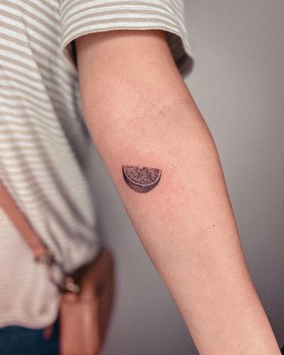 Get a juicy black and gray illustrative tattoo of oranges and lemons, expertly designed by Alex Caldeira.