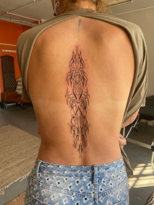 Experience a fusion of ancient tribal art and modern cyber sigilism with this unique illustrative tattoo design by Beth Farbrother.