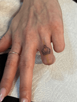 Minimalist Crown Finger Tattoo