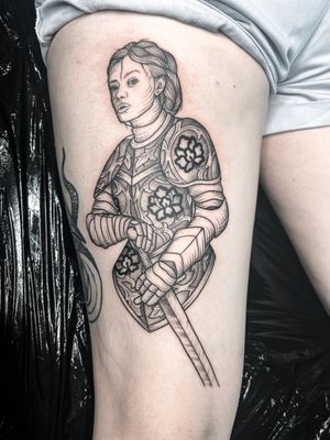 Experience the fierce and powerful depiction of Joan of Arc in intricate blackwork by artist Alexandra Mulhall.