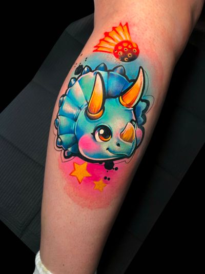 Illustrative and adorable tattoo of a cute triceratops, designed by Cloto.tattoos in watercolor style.