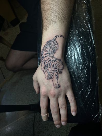 Lurking tiger tattoo from my flash design portfolio on the hand and wrist, done in black ink. Done at B36 Tattoo on Melrose Ave. In Los Angeles!