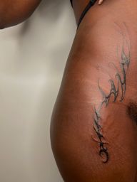 Abstract Neotribal Hip Tattoo