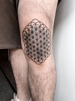 Discover this intricate tattoo by Alexandra Mulhall featuring geometric patterns and the sacred Flower of Life motif.