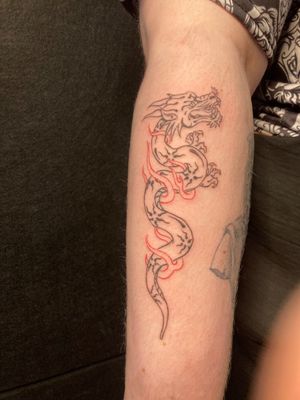 Experience the artistry of fine line and illustrative styles with this captivating ignorant dragon tattoo design.