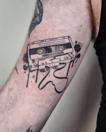 Illustrative retro cassette tattoo with a modern grafitti ink splash twist. 