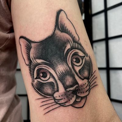 Get inked with a classic cat coverup design in illustrative style by the talented artist Marc 'Cappi' Caplen.