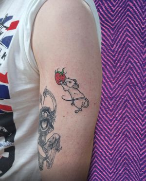 Unique hand-poked tattoo design featuring a rat, mouse, and strawberry by tattoo artist Rachel Howell. A playful and whimsical addition to your tattoo collection.