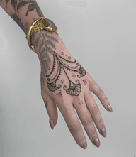 Bold ornamental patternwork tattoo 