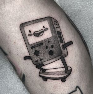 Unique Adventure Time inspired tattoo featuring BMO, created with exceptional illustrative style by talented artist Barbara Nobody.