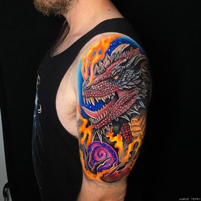 A vibrant neo-traditional dragon tattoo by Marie Terry, featuring intricate illustrative details and bold colors.