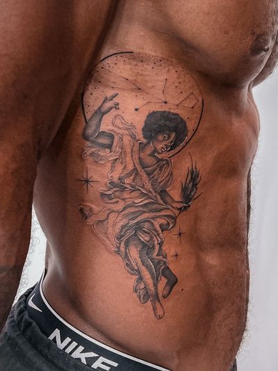 Illustrative black and gray tattoo featuring a deity of African descent surrounded by mystical moon and nature elements, perfect for dark skin.