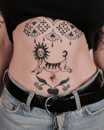 Sun Creature with Floral Accents