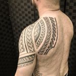 Polynesian-Style Shoulder and Upper Back Tattoo
