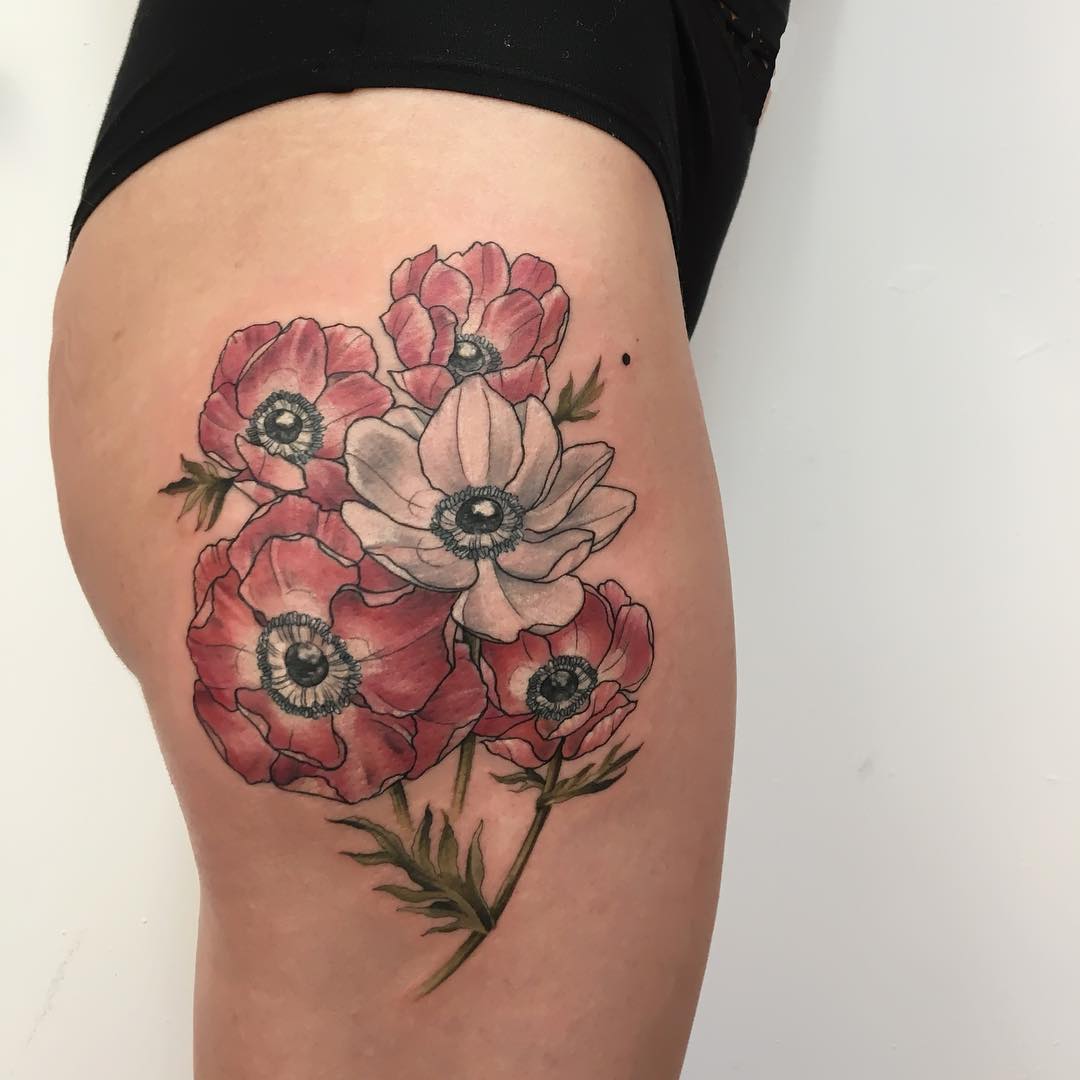 26 Floral Tattoos That Will Make You Swoon  SheSaid  Tulip tattoo Tiny flower  tattoos Wrist tattoos for women