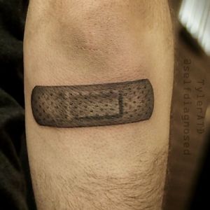 Realistic band-aid tattoo