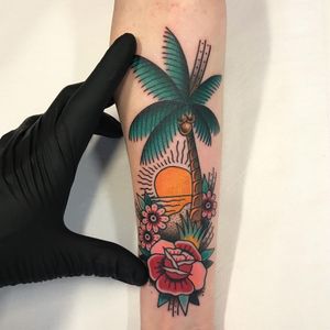 Visions of vacation. Tattoo by Dennis BeBenroth #dennisbebenroth #tropicaltattoos #color #traditional ##island #palmtree #coconuts #flower #leaves #nature #rose #sun #sand #beach #landscape #ocean #waves #birds