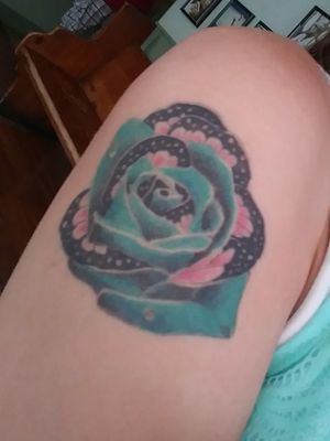 Butterfly rose tattooPink for breast cancer blue for women's assault white for purity black for darkness and the rain drops are my tears!I got this tattoo on my 18th birthday its been over a year! No regrets!