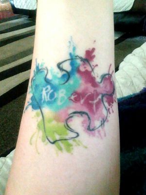 It was a design concept I came up with for my brother. His signature and a puzzle piece for autism awareness. Spencer is the best I kbow at watercolor so it was an easy decision. #watercolortattoos #autism 