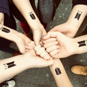 Group of friends with same, BTS A.R.M.Y tattoos