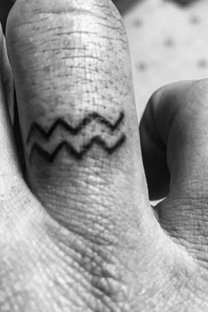 Tattoo Uploaded By Lucas Brice Kelsey • Aquarius Have A Black Sense Of  Humor And Speak Sarcasm Fluently ♒️ #Watercarriers #Tattoos #Fingertattoo  #Sorryforthedirtyhands #Wrinkles #Horoscope • Tattoodo