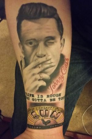This was my first tattoo when I turned 18, I got the portrait first then added the Sun Records logo after.