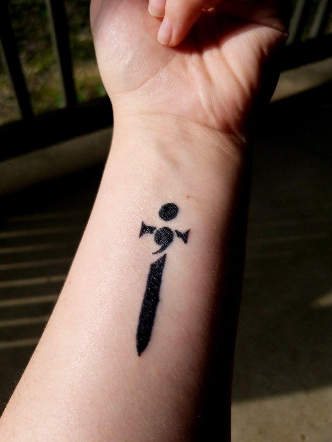 Tattoo uploaded by Rose Shaw • A semi-colon inside a sword on the wrist •  Tattoodo
