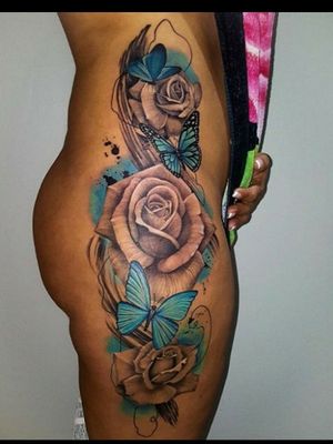 Roses and butterflies thigh tattoo